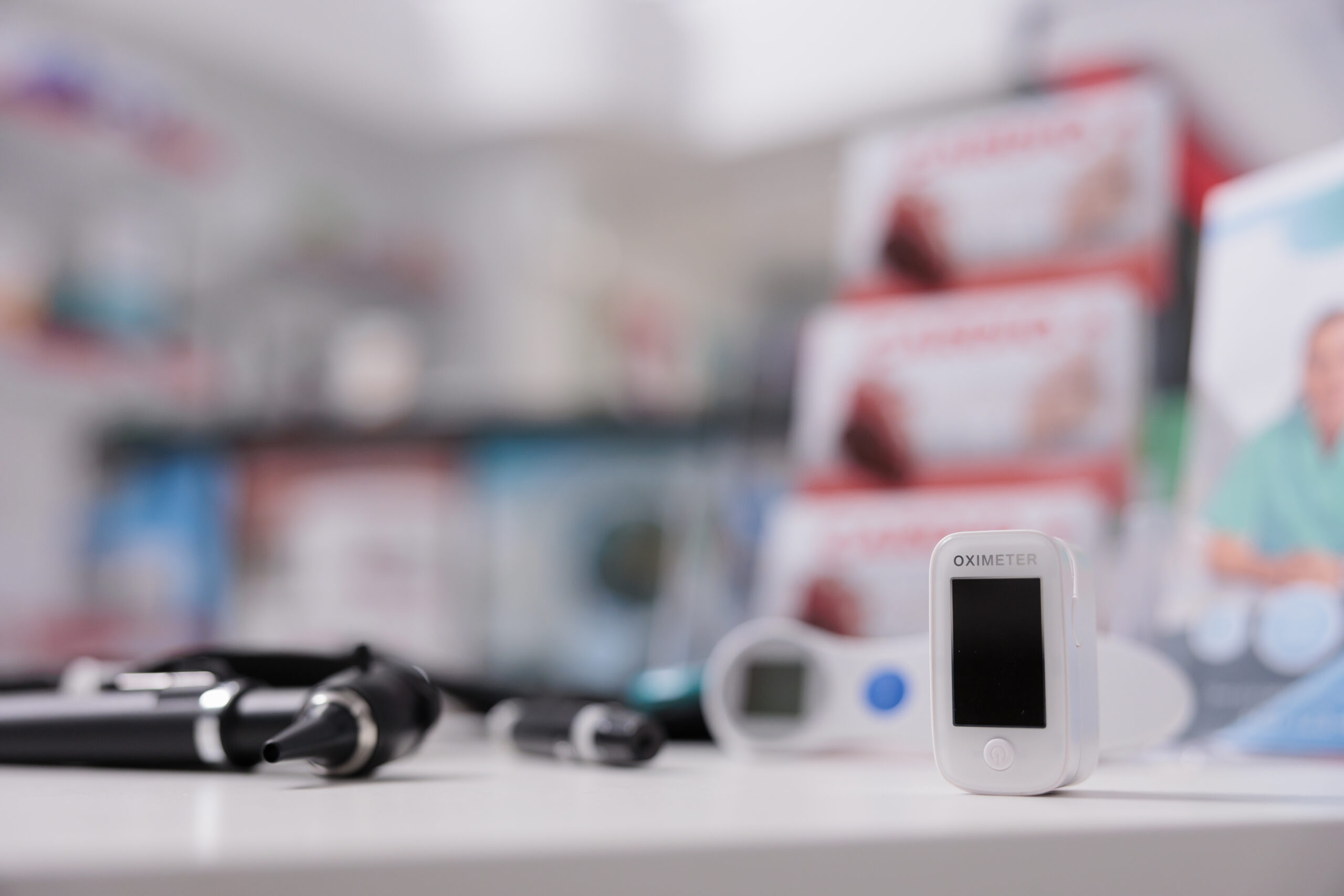 Medical oximeter standing on table in empty drugstore ready to be used by client